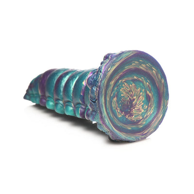 Iridescent teal, purple, gold segmented fantasy silicone adult toy with suction base, inspired by a caterpillar design.