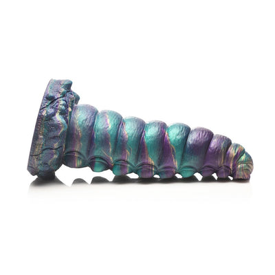 Iridescent teal, purple, and gold segmented fantasy silicone toy with suction cup base, inspired by a caterpillar chrysalis.
