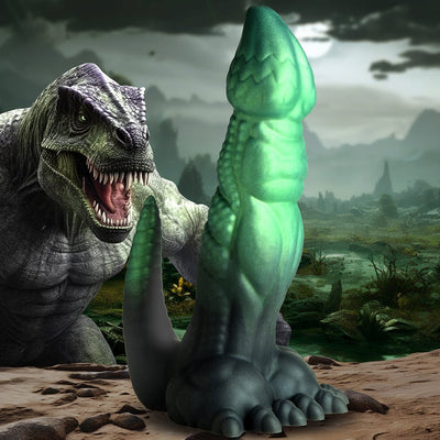 Green and black textured dinosaur-themed silicone adult toy with a tail and clawed feet base against a prehistoric landscape background.