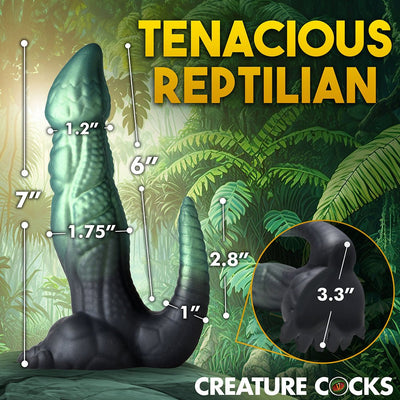 Green and black textured dinosaur-themed adult toy with detailed measurements and clawed base against jungle background.