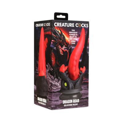 Packaging of Creature Cocks Dragon Roar silicone dildo featuring a red and black dragon-themed design with a long, tapered tongue and suction cup base.