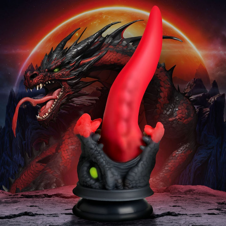 Red and black dragon-themed silicone dildo with a tapered tongue design and suction cup base against a fiery dragon background.