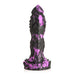 Black and purple textured fantasy dildo with ridges, spikes, and a wide suction cup base for hands-free use.