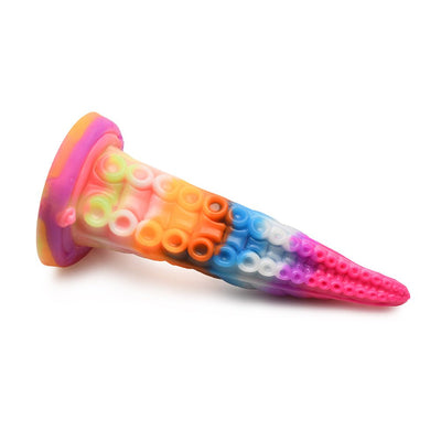 Rainbow-colored silicone tentacle dildo with textured suckers and a wide suction cup base on white background.