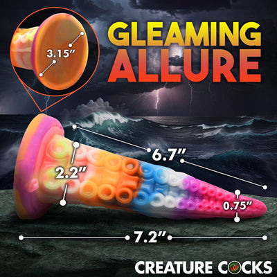 Colorful tentacle-shaped silicone toy with detailed suction cup base and size measurements against a stormy ocean background.