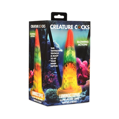 Colorful glow-in-the-dark tentacle dildo with suction base in vibrant rainbow hues, packaged in fantasy ocean-themed box.