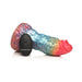 Rainbow-colored textured silicone dildo with tapered head and suction cup base, shown with black remote control.