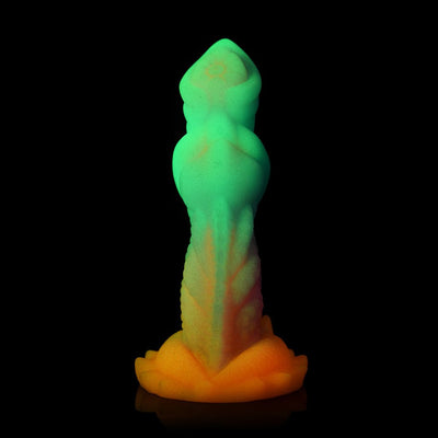 Glow-in-the-dark silicone dildo with textured ridges and a flared orange base, featuring a gradient from green to orange.