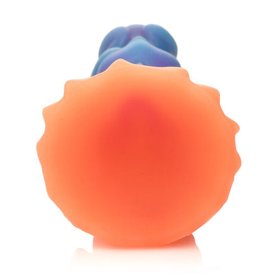 Colorful silicone dildo with textured suction cup base in shades of orange, blue, purple, and pink glitter accents.