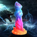 Colorful fantasy-themed silicone dildo with textured ridges and suction base, set against a stormy dragon and lightning background.
