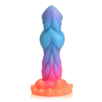 Colorful silicone fantasy dildo with textured ridges and suction cup base in blue, purple, and orange gradient hues.