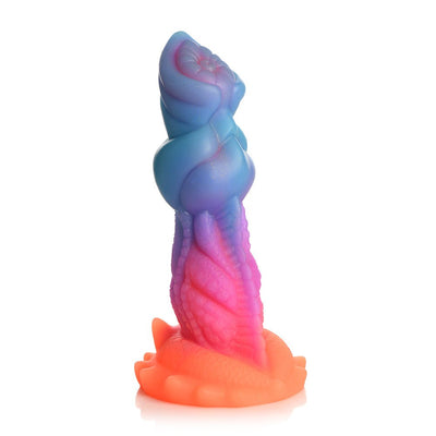 Colorful silicone fantasy dildo with textured ridges and suction cup base in vibrant blue, purple, pink, and orange hues.