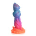 Colorful silicone fantasy dildo with textured ridges and suction cup base in vibrant blue, purple, pink, and orange hues.