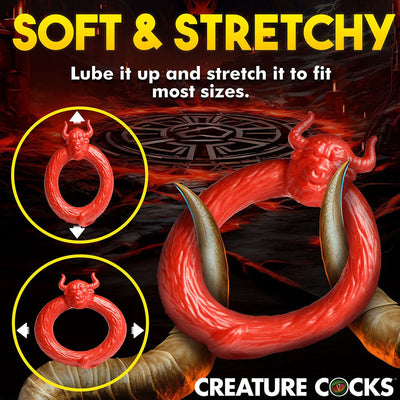 Red stretchy silicone c-ring with a bull head design, shown flexible to fit various sizes.