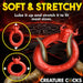 Red stretchy silicone c-ring with a bull head design, shown flexible to fit various sizes.