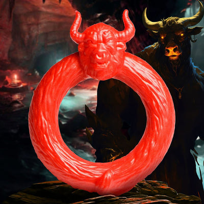 Bright red stretchy silicone c-ring featuring a detailed bull head with horns, set against a dark fantasy cave background.