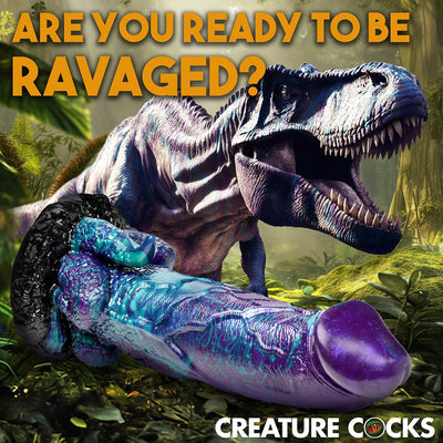 Colorful blue and purple dinosaur-themed adult toy with textured details and suction base in a jungle setting with a roaring T-Rex.