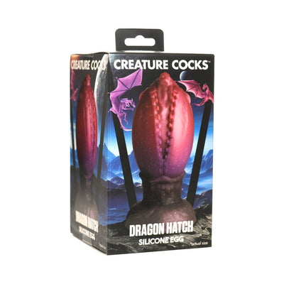Packaging box of Creature Cocks Dragon Hatch Egg silicone toy with dragon-themed design and dark red textured egg image.