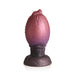 Large dragon egg-shaped silicone plug with glittery red to purple gradient and textured dragon head tip.