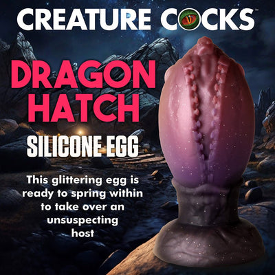 Dragon Hatch Egg XL silicone plug with glittery red and purple textured surface, designed with a wide base for safe use.