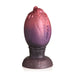Dragon egg-shaped silicone plug with textured ridges and glittery red to purple gradient finish on a wide base.