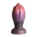 Dragon egg-shaped silicone plug with textured ridges and gradient red to purple color, featuring a wide base for secure use.