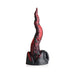 Red and black textured dragon tongue silicone dildo with suction cup base on white background