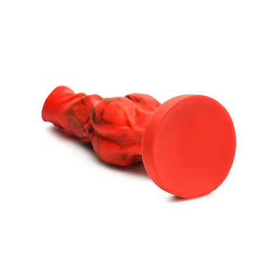 Red and black fantasy silicone dildo with textured bulges and wide suction cup base for hands-free use.
