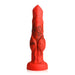 Red and black silicone fantasy dildo with bulging knots and suction cup base, standing upright on white background.