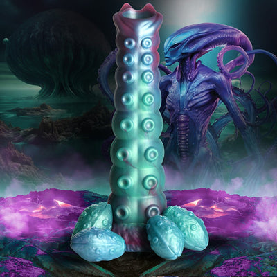 Iridescent teal and purple segmented ovipositor dildo with textured bumps and four detachable egg-shaped accessories, set against a sci-fi alien landscape.