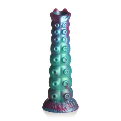 Iridescent teal, blue, and red textured ovipositor dildo with suction base and open-mouthed tip for fantasy play.