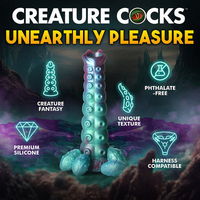 Iridescent teal, red, and blue alien-inspired ovipositor dildo with textured bumps and four egg-like shapes at the base, shown with product features.