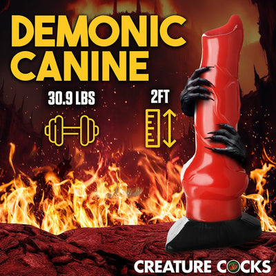 Red and black 2-foot tall demon canine fantasy dildo held by black clawed hands against fiery background with product weight and size details.