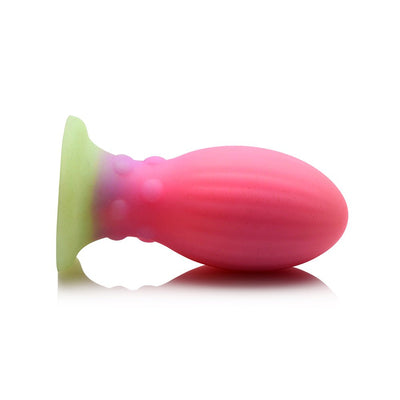 Large multi-color silicone egg with ribbed and bumpy texture, designed to glow in the dark for unique sensory play.
