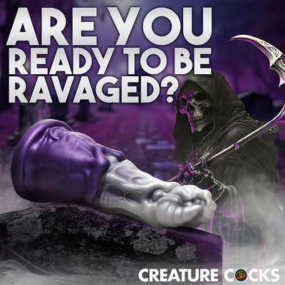 Grim Reaper-themed dildo with silver textured shaft and purple cloak base, set against a dark, misty background with a skeletal figure.