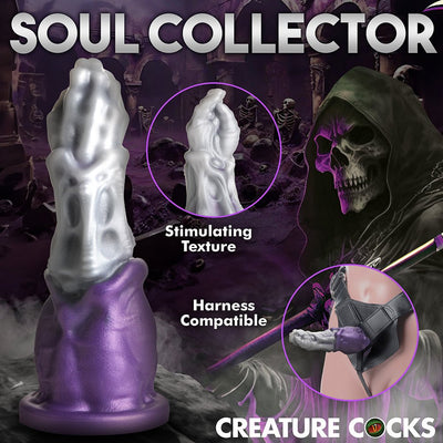 Purple and silver Grim Reaper themed dildo with textured surface and wide suction base, shown with harness compatibility.