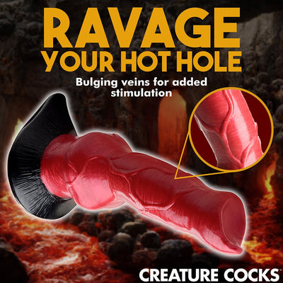 Red and black silicone canine-inspired dildo with bulging veins and suction cup base against fiery background