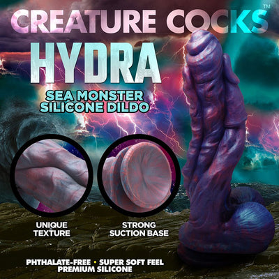 Three-headed sea monster dildo in swirling blue, red, and purple silicone with textured surface and suction cup base.