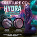Three-headed sea monster dildo in swirling blue, red, and purple silicone with textured surface and suction cup base.