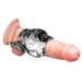 Silver and black silicone girth enhancer sleeve with attached ball strap on a realistic model.