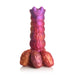 Sunset-colored silicone ovipositor dildo with textured segmented shaft and three detachable egg-shaped accessories.