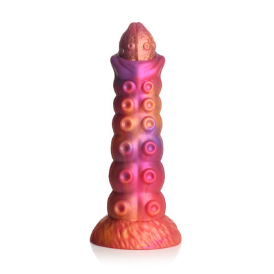Sunset-colored silicone dildo with textured tentacle-like suction cups and a flared base for harness use.