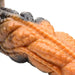 Close-up of textured orange and black rippled silicone dildo with detailed ridges and scales.