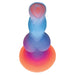 Colorful silicone alien-themed dildo with glowing effect and suction base, featuring vibrant blue, purple, and orange hues.
