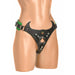 Black and green creature-themed strap-on harness with adjustable buckles and central O-ring on mannequin torso.