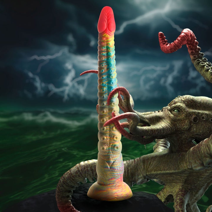 Colorful tentacle-inspired dildo with suction cup base, displayed with a mythical sea creature in stormy ocean setting.