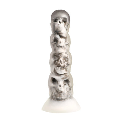 White and gray silicone dildo shaped as a vertical tower of detailed skulls with a suction cup base.