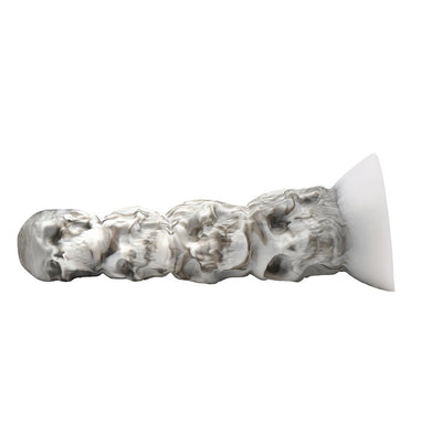 White and gray silicone dildo featuring a textured tower of skulls with a wide suction cup base for hands-free use.