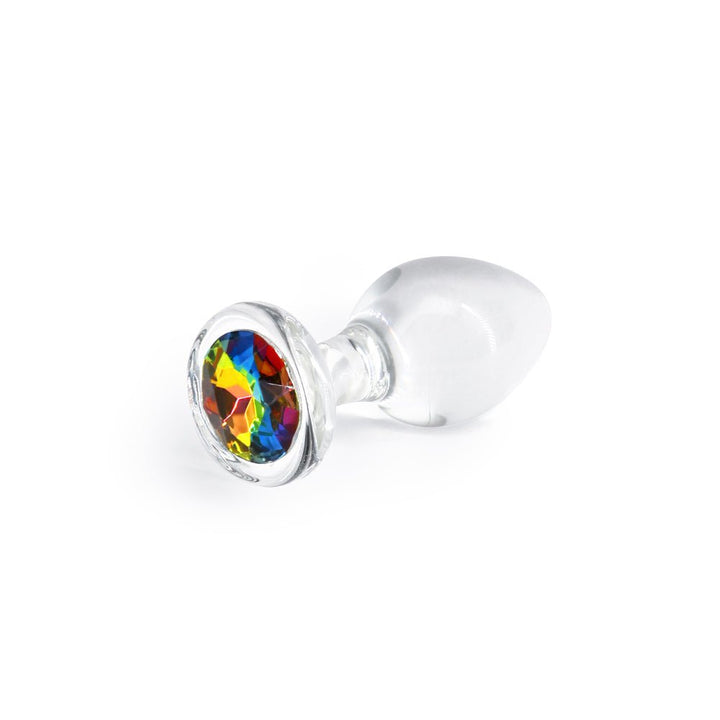 Medium clear glass butt plug with a round, multi-colored rainbow gem base on a white background.