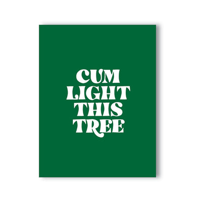 Green greeting card with bold white text reading Cum Light This Tree in playful font